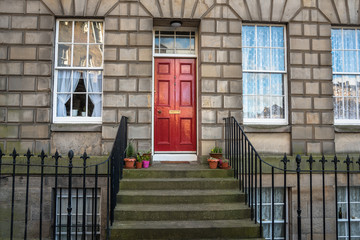 Red Wooden Front Door of an Historic Terraced Building