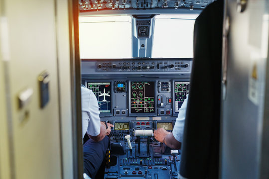 Dashboard of cockpit with pilots