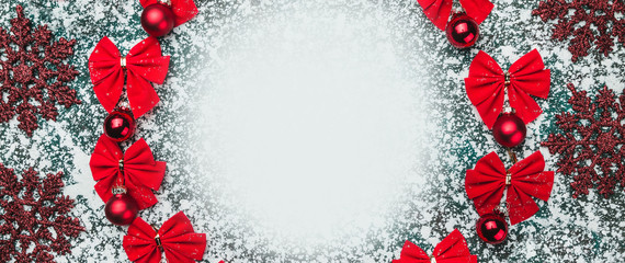 Red bows and tree globes, balls with space for text writing inside and handmade decorative toys, Xmas greeting card