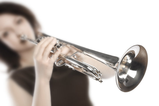Trumpet player. Woman trumpeter playing jazz