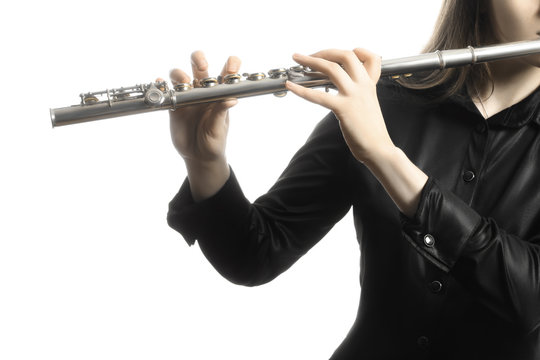 Flute instrument. Flutist hands playing flute