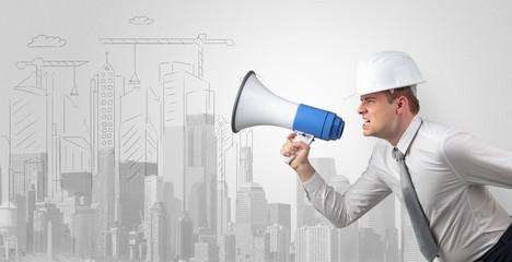 Fototapeta premium Young supervisor architect yelling to a big city panorama 