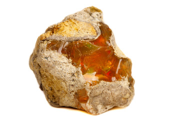 Macro Opal mineral stone in rock on white background