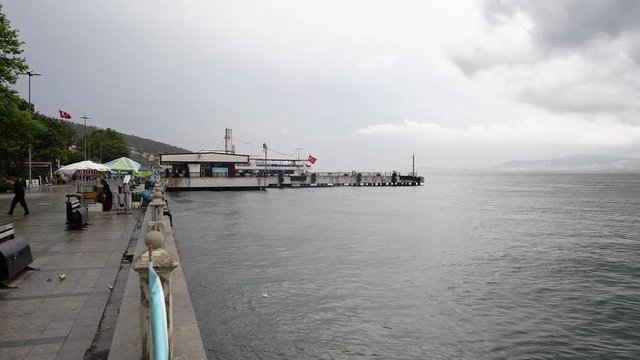 Slow motion Ferry Port of Heybeli Island in an overcast cloudy day