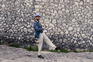 Hipster man in vintage suit walking in the street