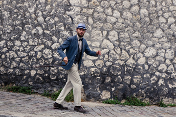 Dancing hipster man in vintage suit