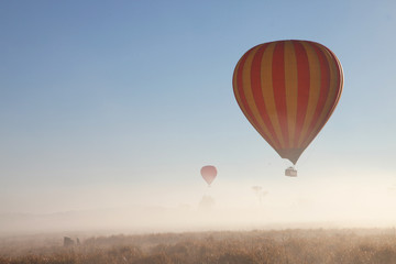 Hot Air Balloon flight over Gold Coast Hinterland, Queensland, Australia at sunrise in mid winter