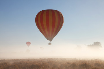 Hot Air Balloon flight over Gold Coast Hinterland, Queensland, Australia at sunrise in mid winter