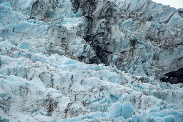 Close up view of teal blue colored Holgate Glacier in Alaska's Kenai Fjords National Park