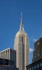 Fototapete Empire State Building blue sky day in metropolis midtown New York city building skyline