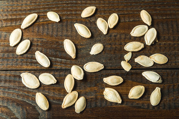 Pumpkin seeds with a wooden background