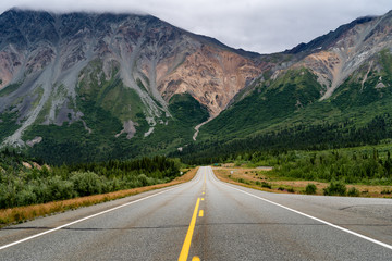 View of the Richardson Highway near Delta Junction Alaska. Empty road in the middle of the highway. Delta mountains