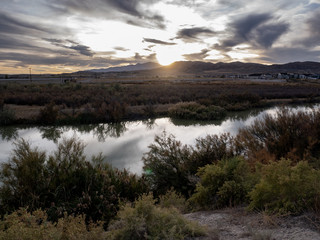 Panorama sunset with clouds reflecting off the river