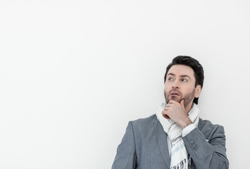 close up.business man in scarf looking up somewhere