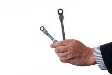 Mechanic engineer holding two ratchet box end wrench in his hand; handing tool on white background