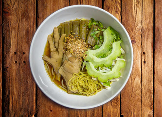 Chicken Noodle Placed on Wooden Table