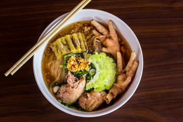 Chicken Noodle Placed on Wooden Table