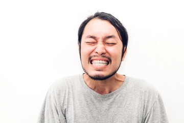 Portrait of happy smiling asian young handsome man on white background