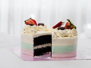 Cutting butter cream of chocolate on table.