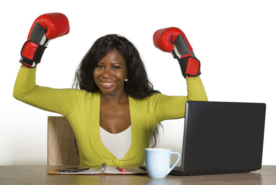 happy beautiful black afro American woman in boxing gloves smiling cheerful working at office computer desk posing as successful executive in business success