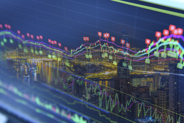 Double exposure of stocks market chart in blue on LED display concept with city scape hong kong...