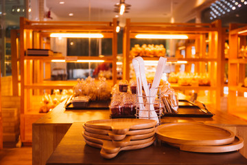 Close-up of bakery store shop with freshly baked breads on shelf.
