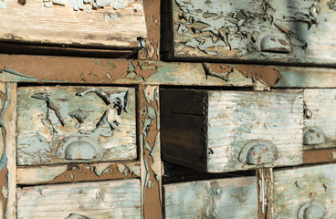 Wooden drawers with cracked paint