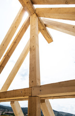 Building a house, wooden beams