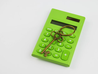 House key and calculator on white background