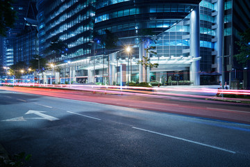 Modern building with light trails on night scene  background