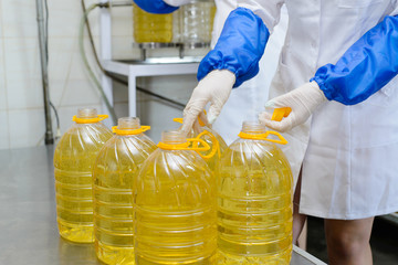 Sunflower oil factory. Factory line of production and filling of refined oil from sunflower seeds.