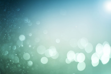 Blurred abstract bokeh light of fly water background, Christmas two tone colors.