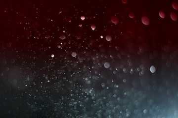 Blurred abstract bokeh light of fly water background, Christmas two tone colors.