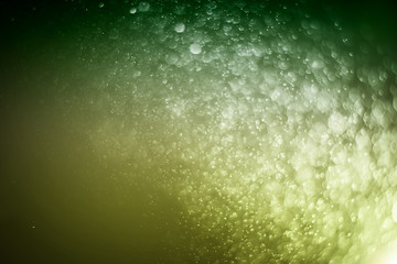 Blurred abstract bokeh light of fly water background, Christmas two tone colors.