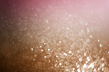 Blurred abstract bokeh light of fly water background, Christmas two tone colors.
