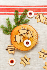 Assortement of homemade Christmas sweets, linzer and sugar cookies in the shape of a star. Top view.