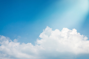 Naklejka na ściany i meble Summer blue sky background with white clouds and beautiful light of heaven.