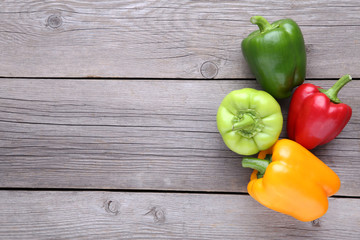 Colorful pepper on a grey wooden background