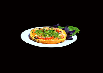 Omelet on a platter on the black background