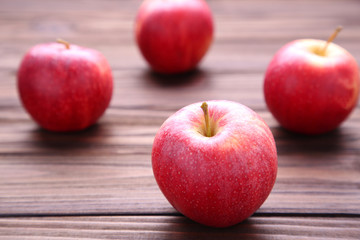 Fresh red apples on wooden background.Tasty apples on brown table