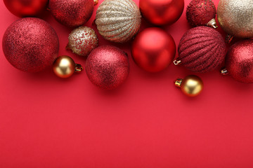 Red and gold christmas balls on a red background