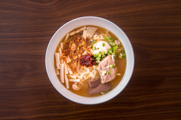 Chicken Noodle Placed on Wooden Table
