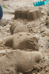 various objects built with sand forms in the sand