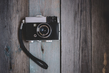 top view Vintage camera on dark wooden background
