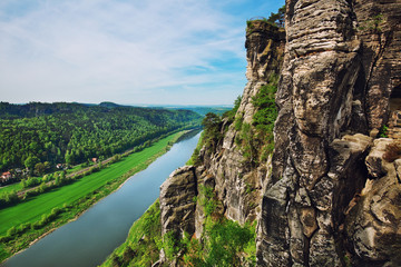 View from the cliff to the river valley in Saxon Switzerland National park, popular travel destination in Germany