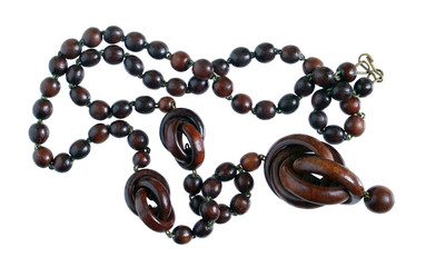 Homemade female beads are made of african ebony wood  dark red balls. Isolated