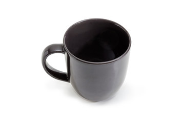 Empty black cup with handle on a white background