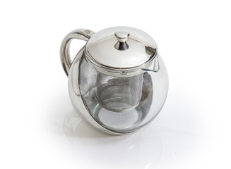 Empty stainless steel and glass teapot with strainer