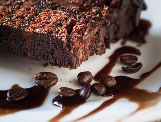 Slice of cake with cream coffee and coffee beans