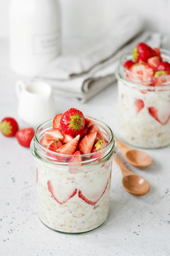 Vegan or vegetarian food overnight oats with strawberries for healthy breakfast and healthy lifestyle. Closeup view, selective focus